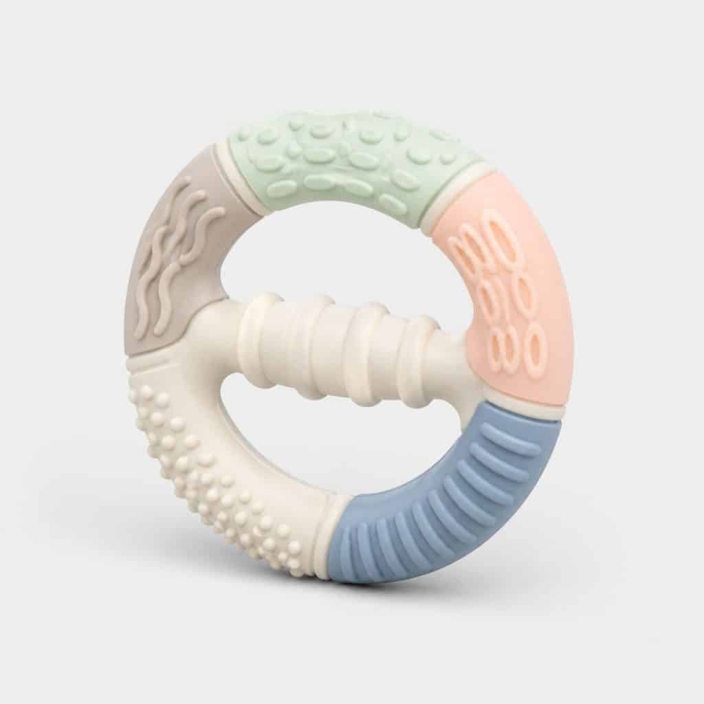 Anneau de dentition texturé multi-surfaces avec poignée centrale