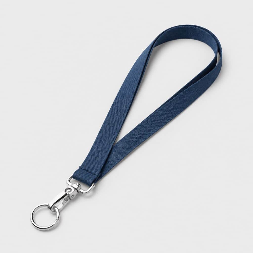 Attache-tétine en tissu avec clip et anneau posé à plat