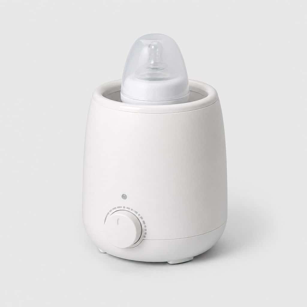 Chauffe-biberon électrique blanc avec cuve ronde et bouton de réglage