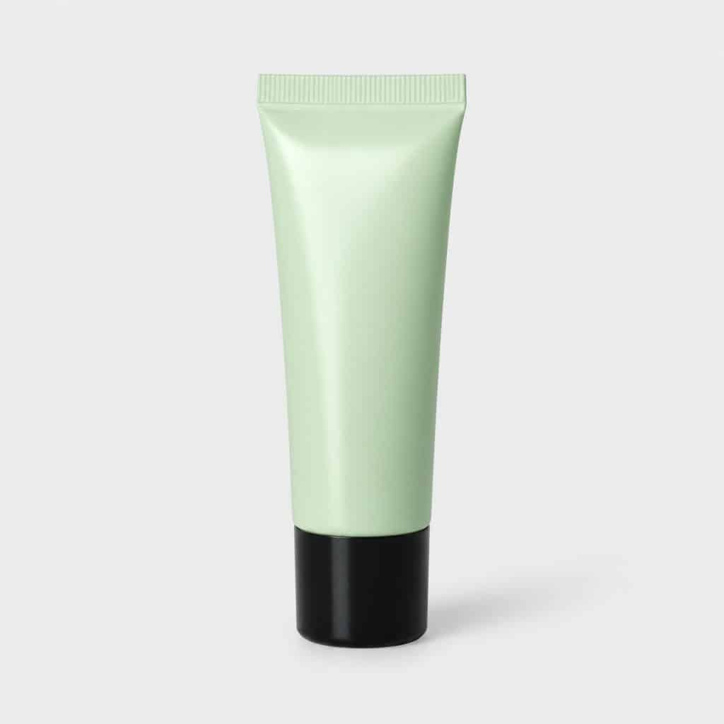 Tube vert du correcteur de teint anti-rougeurs