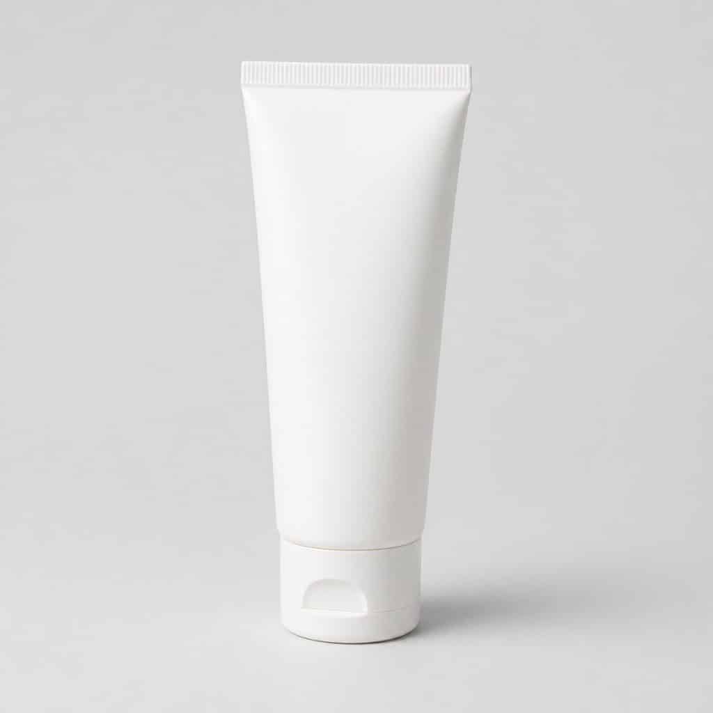 Tube de crème protectrice pour bébé posé debout