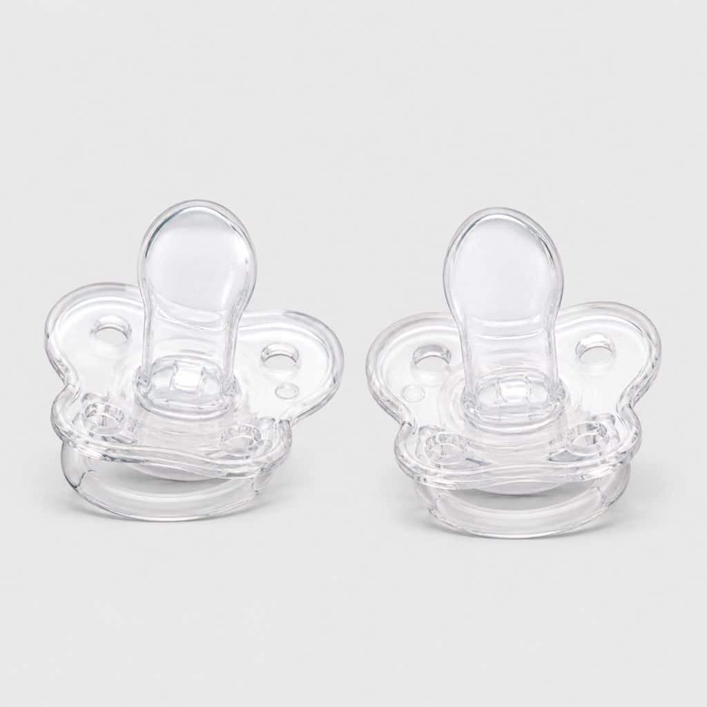 Lot de deux sucettes physiologiques en silicone sur fond neutre